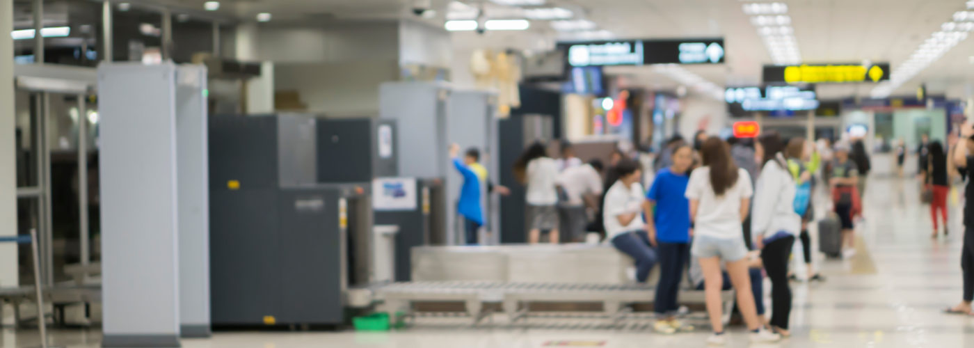 People waiting in line at airport security