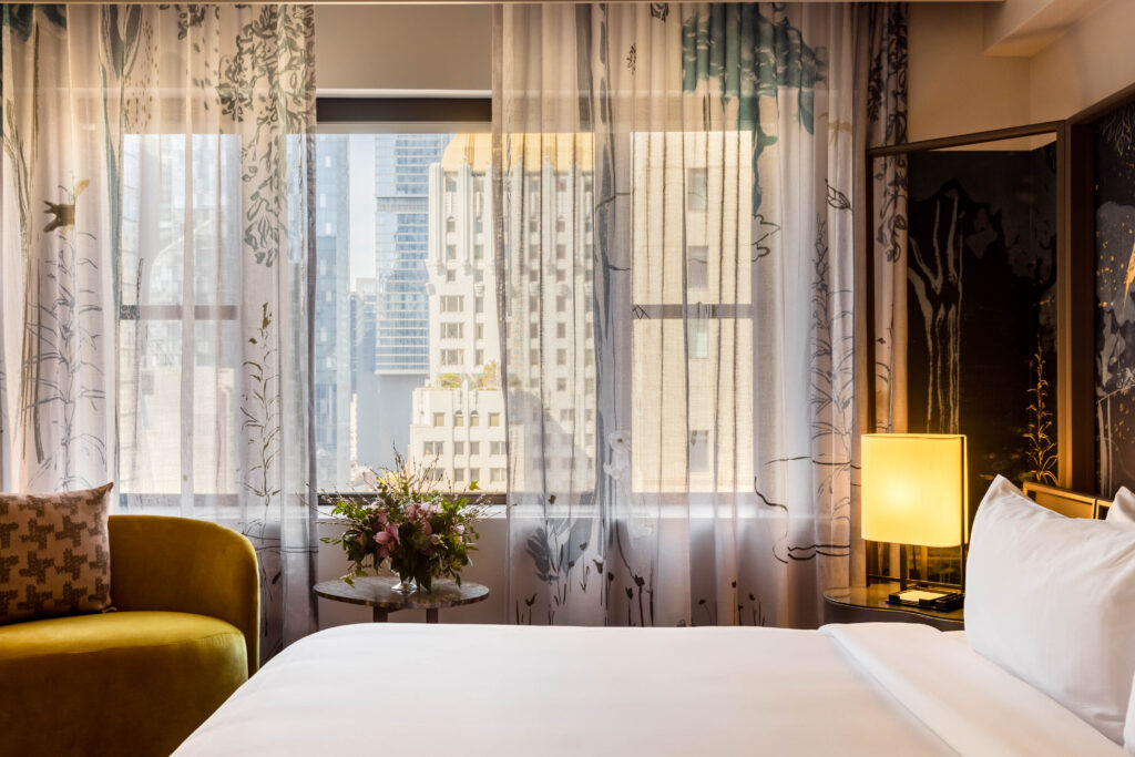 Guestroom with view of the city in Park Lane New York