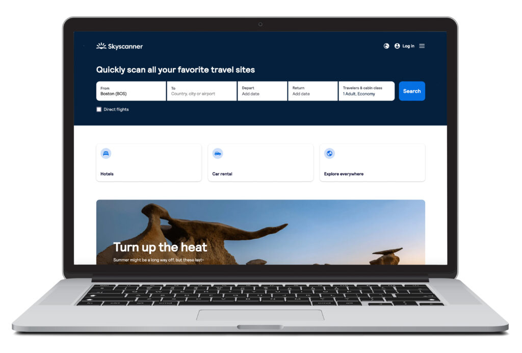 Open laptop showing flight search homescreen for Skyscanner